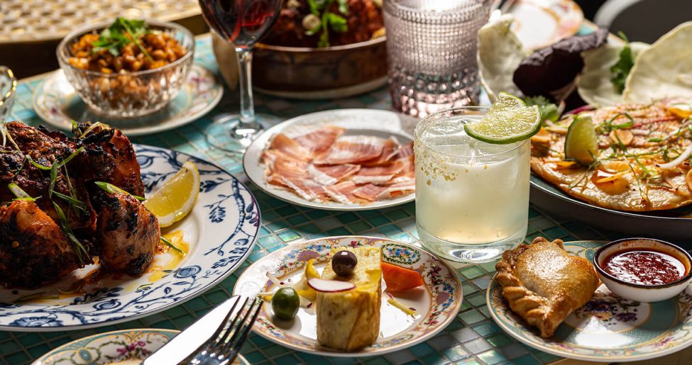 Spread of assorted dishes and cocktails